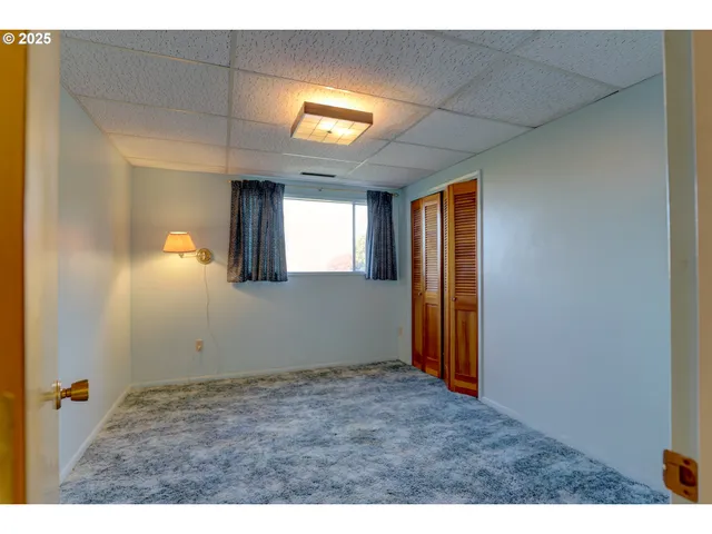 a view of empty room with windows