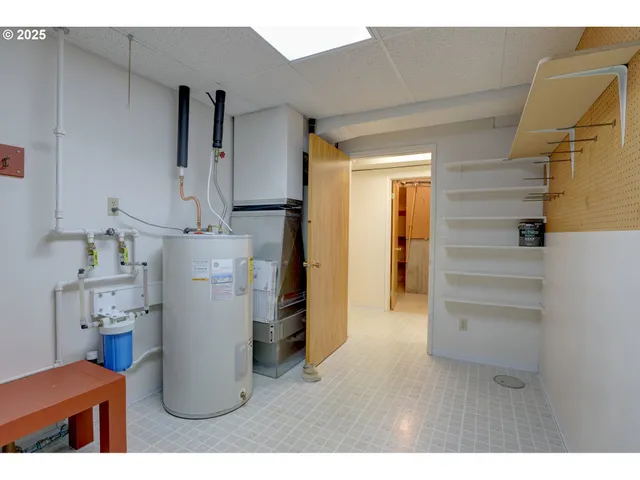 a kitchen with refrigerator and cabinets