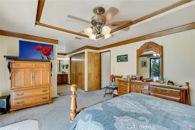 a bedroom with bed and gym equipment