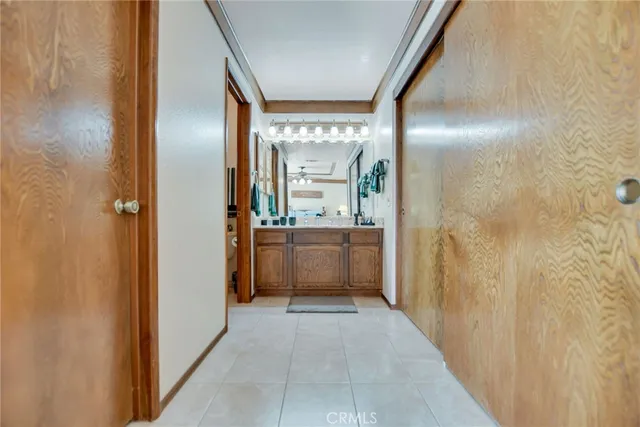 a bathroom with a double vanity sink a mirror and a shower