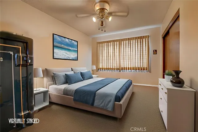 a bedroom with bed and a window