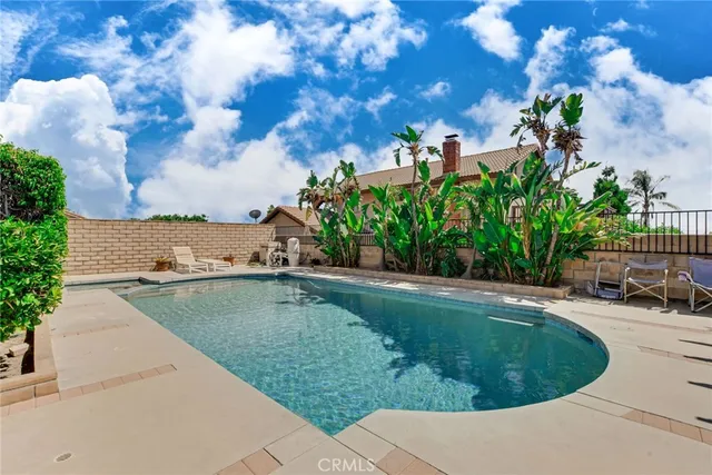 a view of a swimming pool with a yard