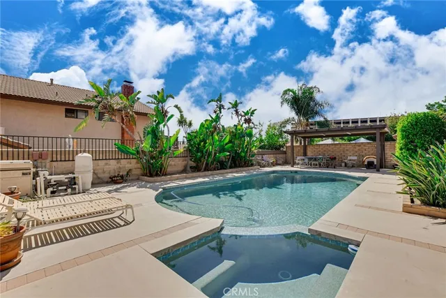 a view of a swimming pool with a patio