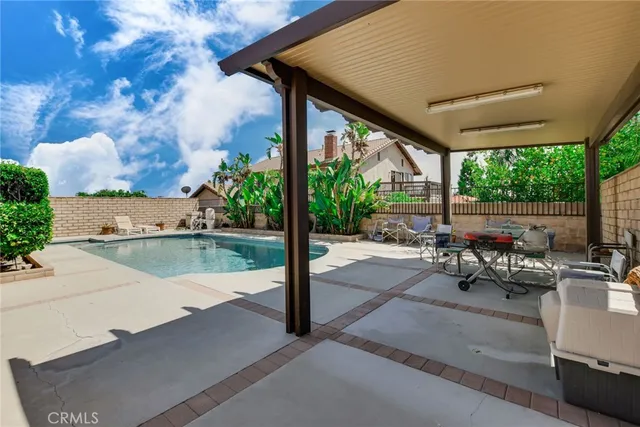 a view of swimming pool with outdoor seating