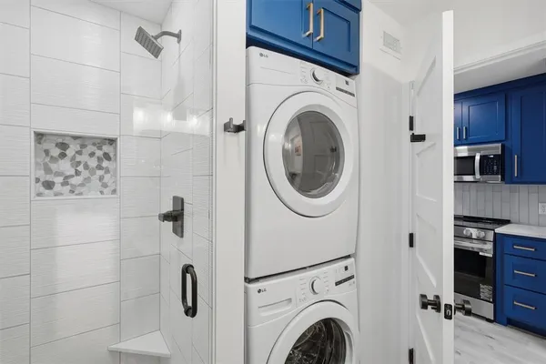 a view of a hallway with washer and dryer