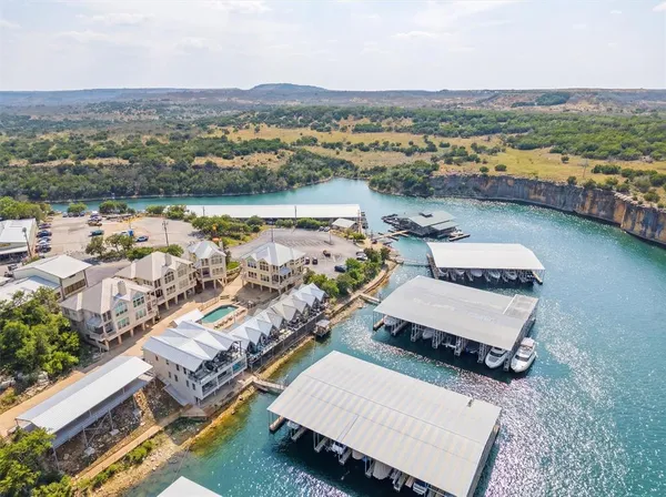 an aerial view of a house with a lake view