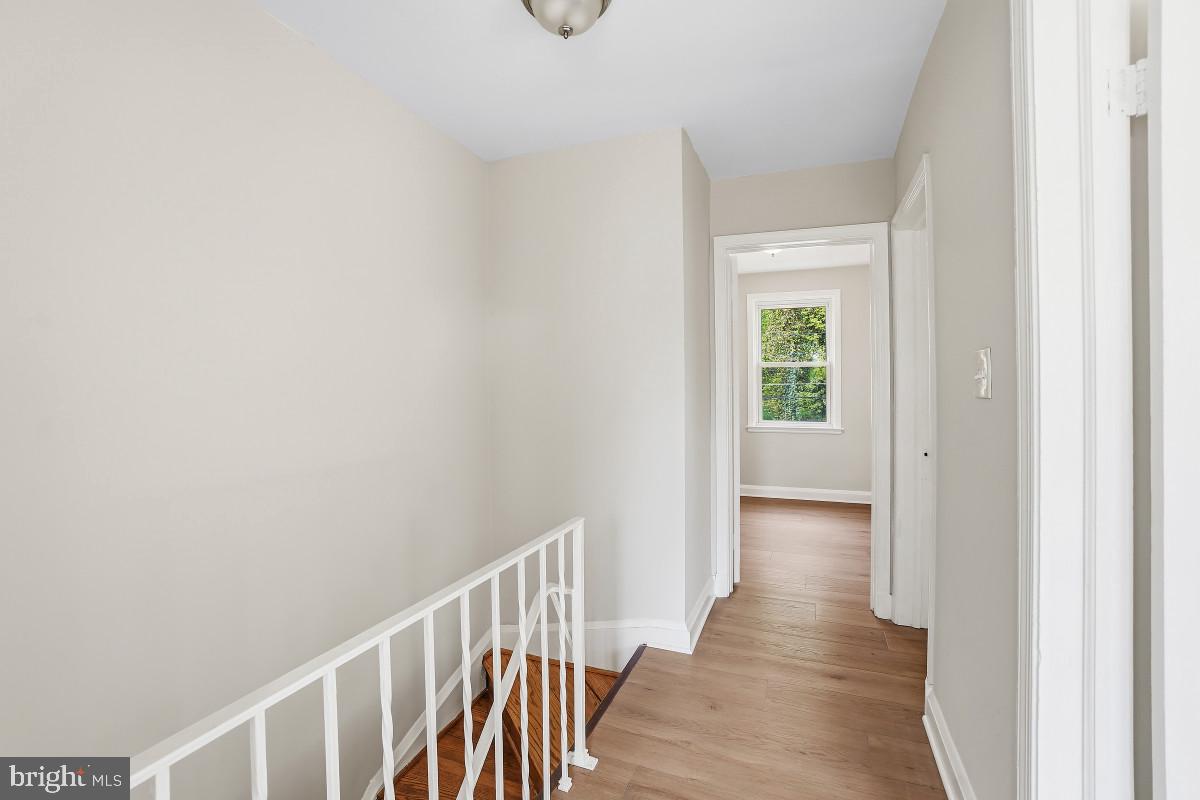 162 Cherrydell Road Baltimore, MD 21228 - Photo 13 of 31 Bright and airy hallway invites exploration.