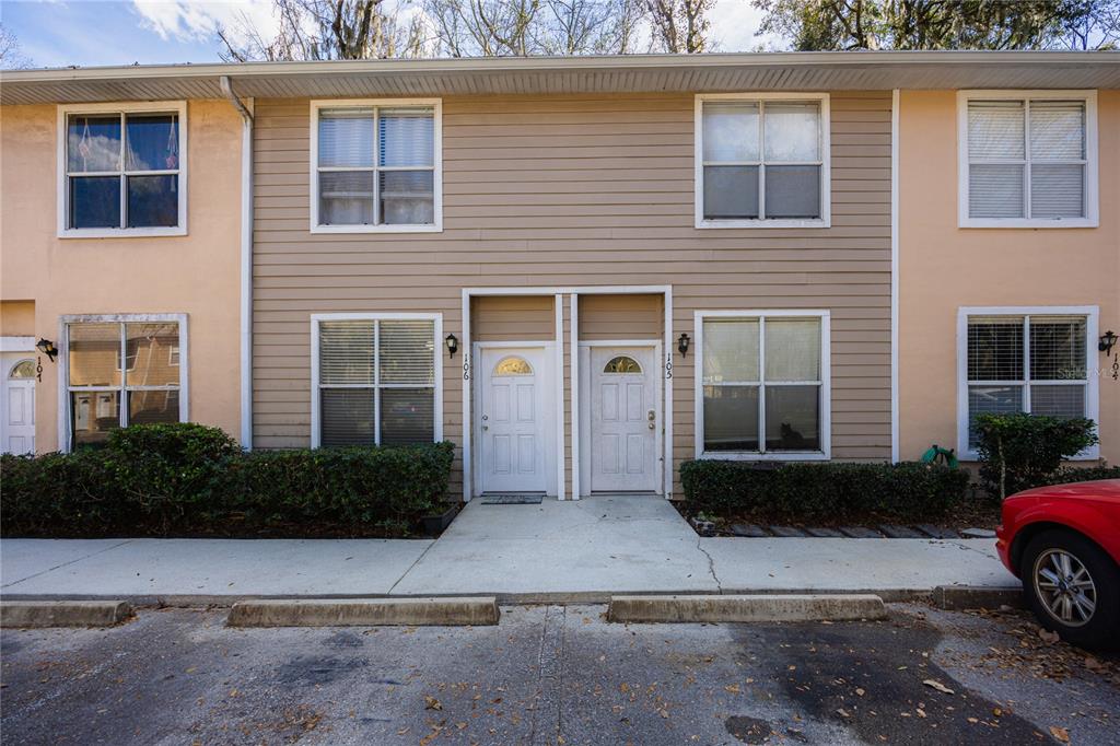 4415 Southwest 34th Street, Unit 106 Gainesville, FL 32608 - Photo 1 of 1 a view of a house with outdoor space