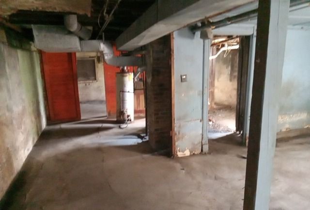 6531 South May Street Chicago, IL 60621 - Photo 11 of 12 a view of a room with wooden walls