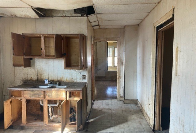 6531 South May Street Chicago, IL 60621 - Photo 6 of 12 a kitchen with a sink cabinets and a stove