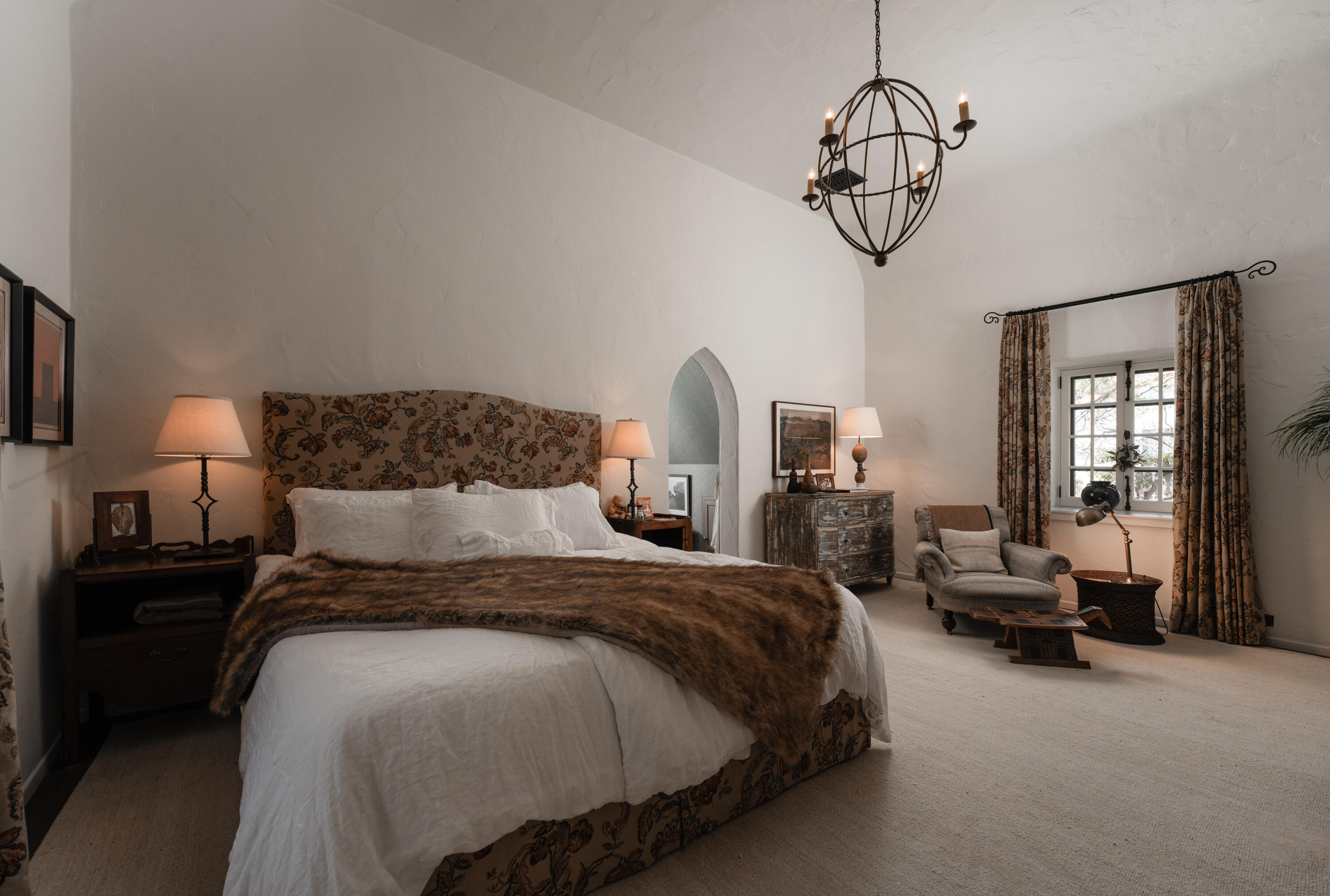 175 Miramar Avenue Montecito, CA 93108 - Photo 16 of 33 a bedroom with bed and a chandelier