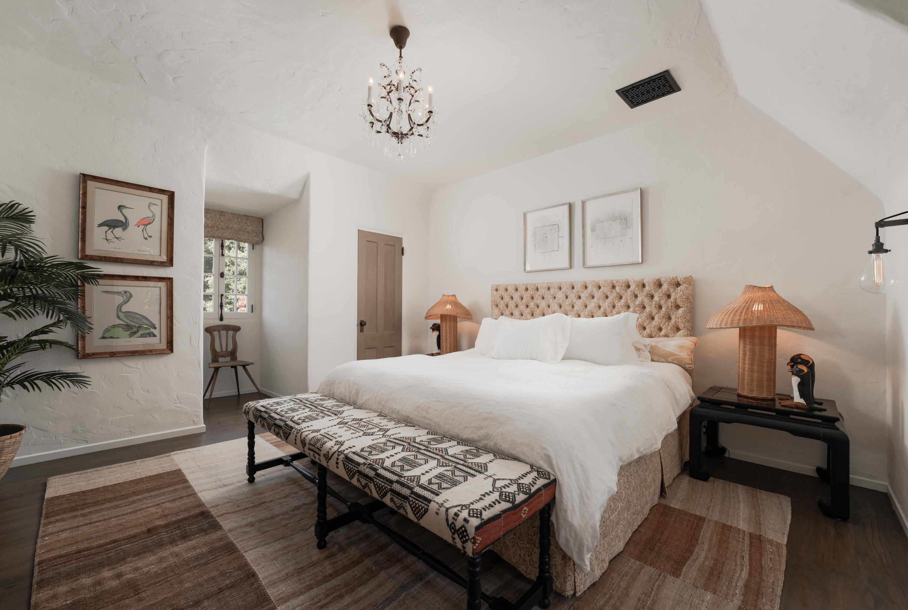 175 Miramar Avenue Montecito, CA 93108 - Photo 22 of 33 a bedroom with a bed and wooden floor