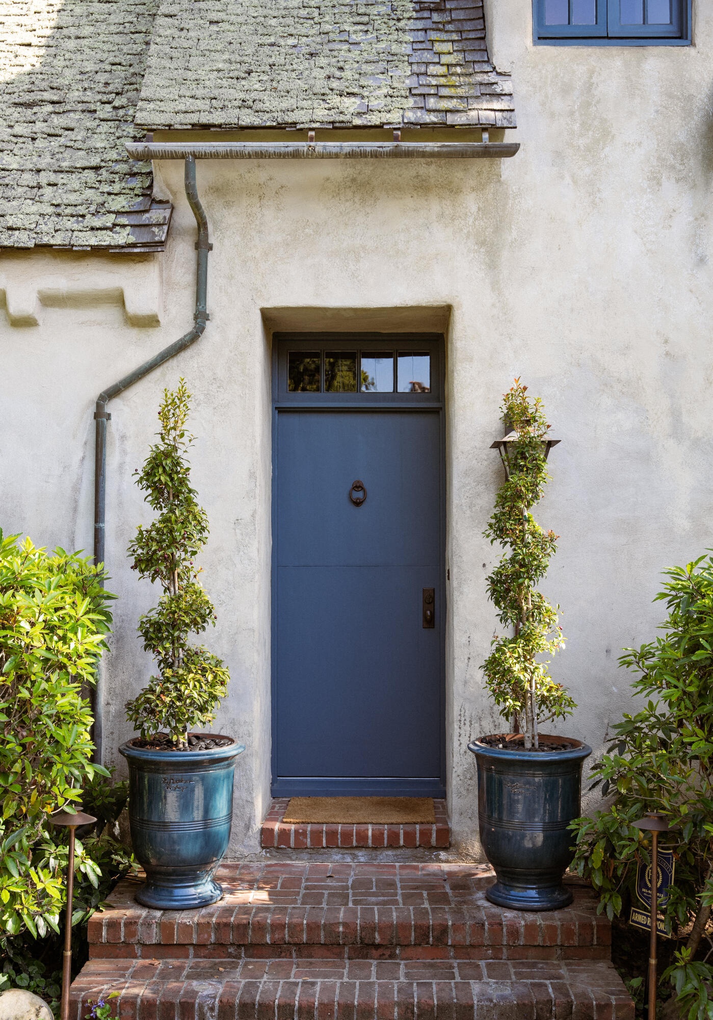 175 Miramar Avenue Montecito, CA 93108 - Photo 3 of 33 a front view of a house with potted plants