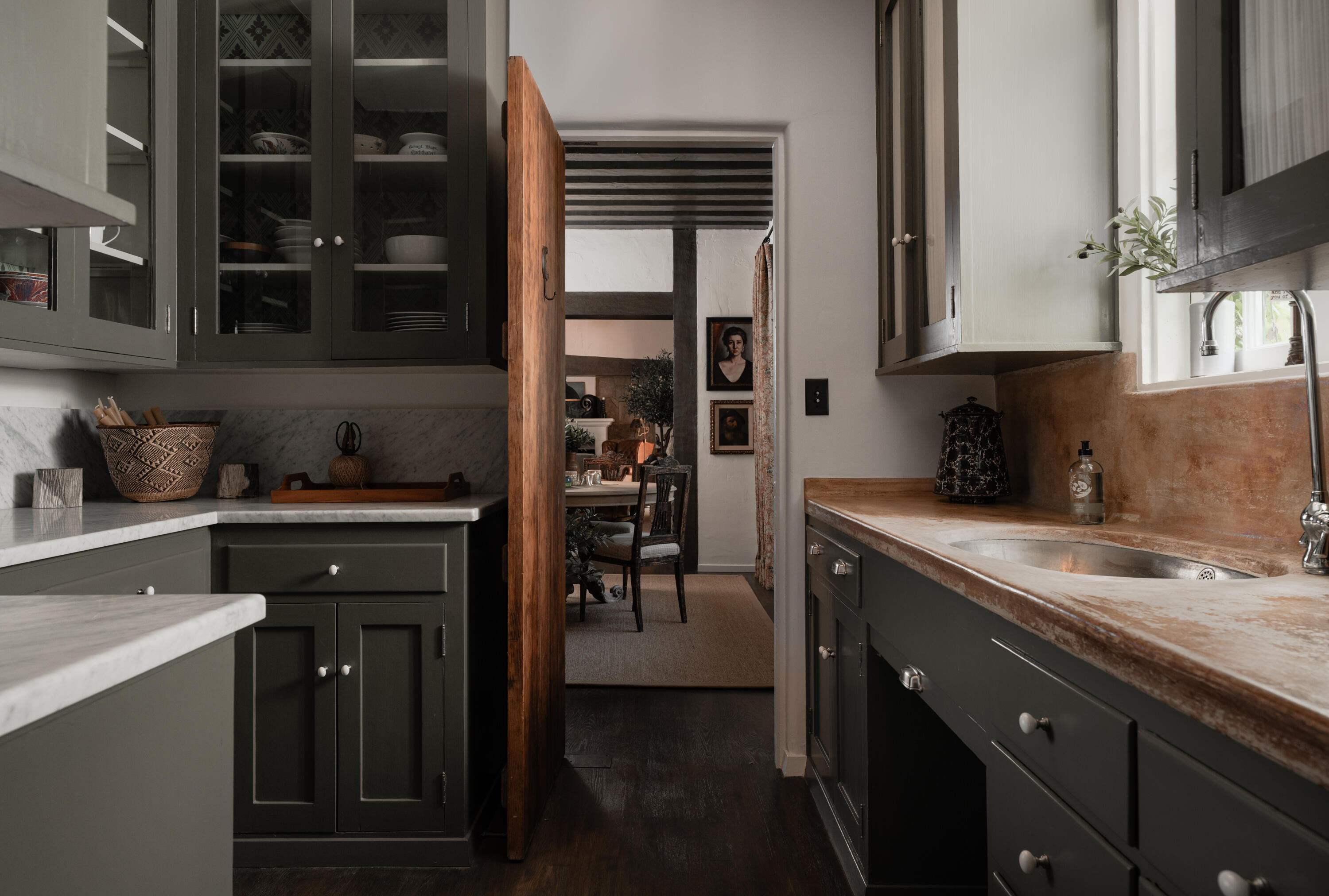 175 Miramar Avenue Montecito, CA 93108 - Photo 9 of 33 a kitchen with a sink and cabinets