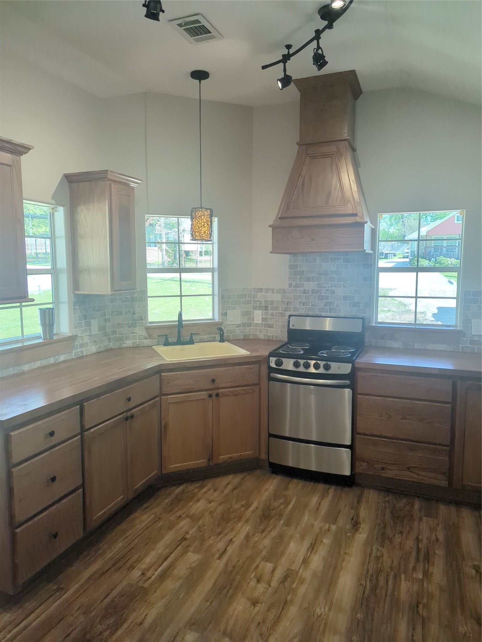 16 Walnut Lane Huntsville, TX 77320 - Photo 11 of 15 a kitchen with a stove a sink and a window