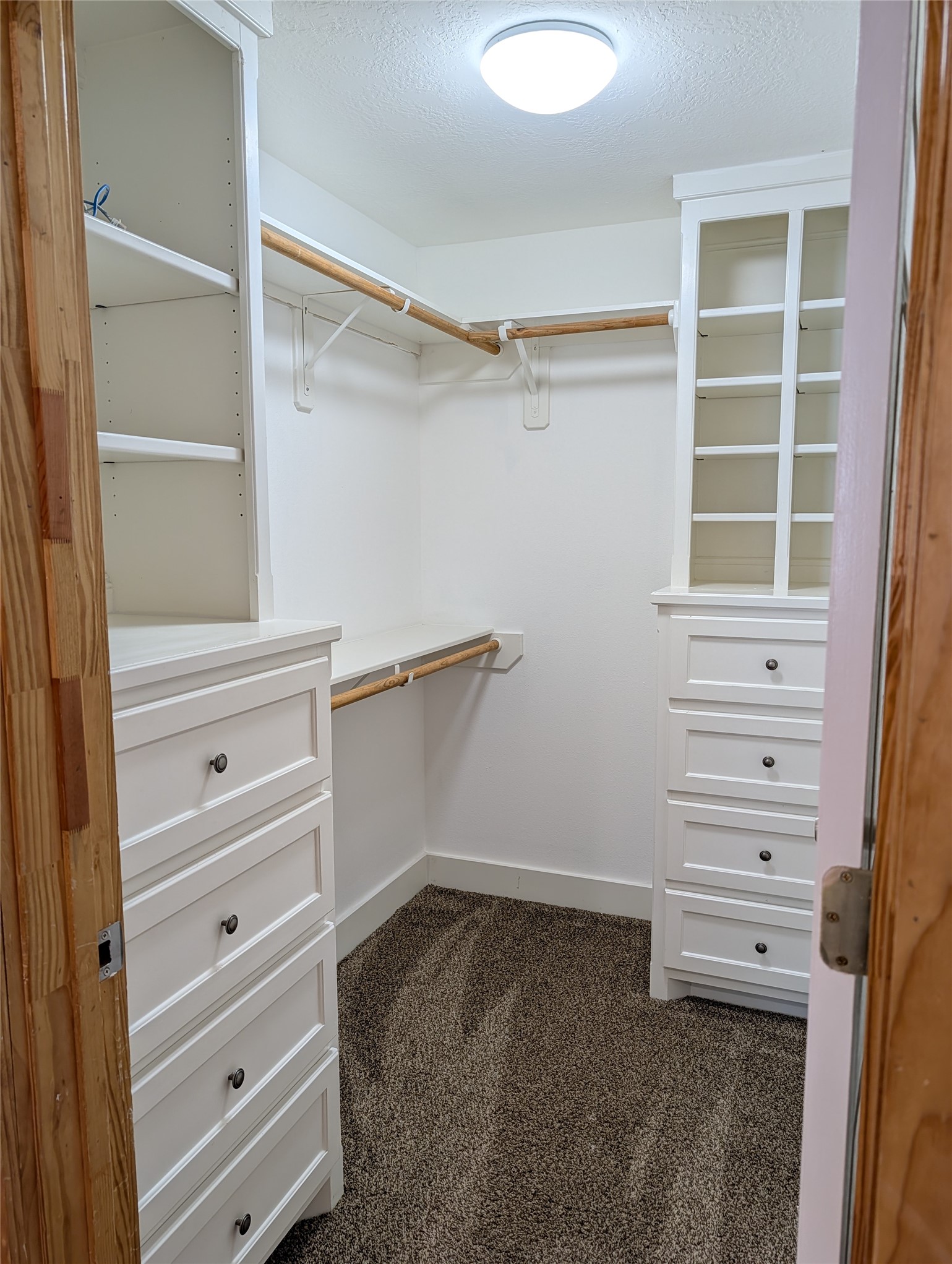 16 Walnut Lane Huntsville, TX 77320 - Photo 7 of 15 a view of walk in closet