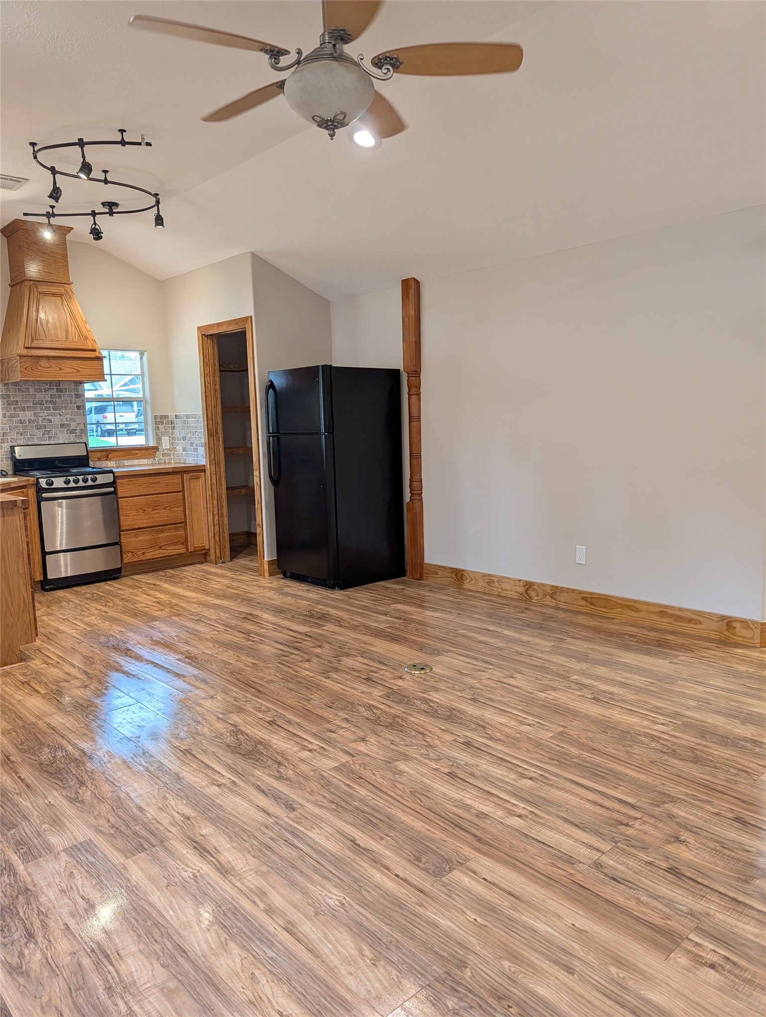 16 Walnut Lane Huntsville, TX 77320 - Photo 9 of 15 a view of a kitchen with a sink and a refrigerator
