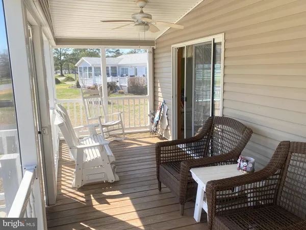 a view of a two chairs in the balcony
