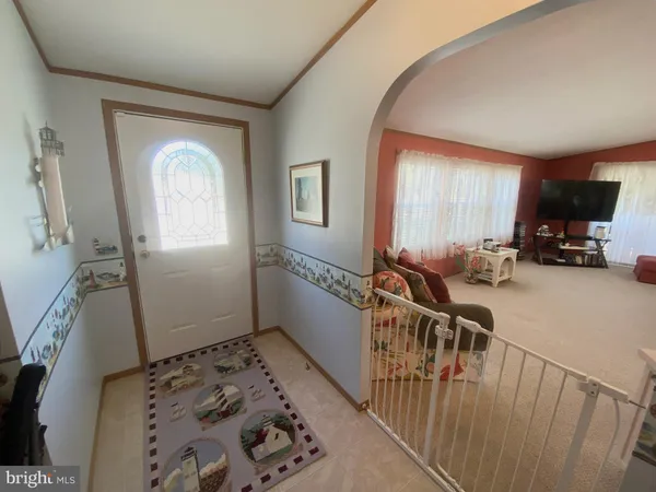 a view of livingroom with furniture and windows