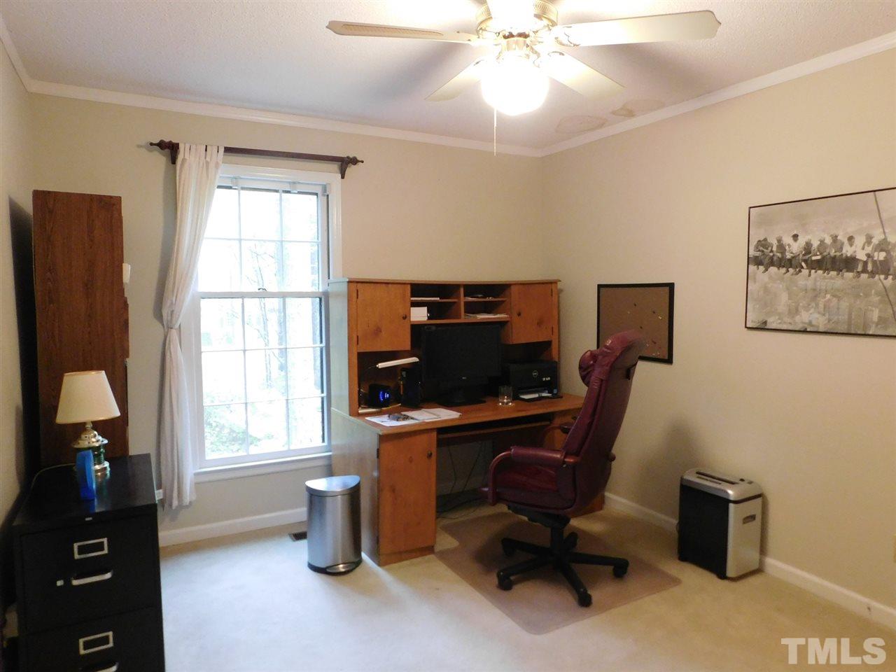 3224 Brennan Drive Raleigh, NC 27613 - Photo 15 of 22 a view of a workspace with furniture and a window