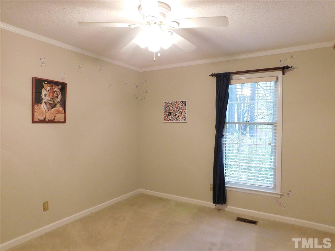 3224 Brennan Drive Raleigh, NC 27613 - Photo 16 of 22 an empty room with windows and fan