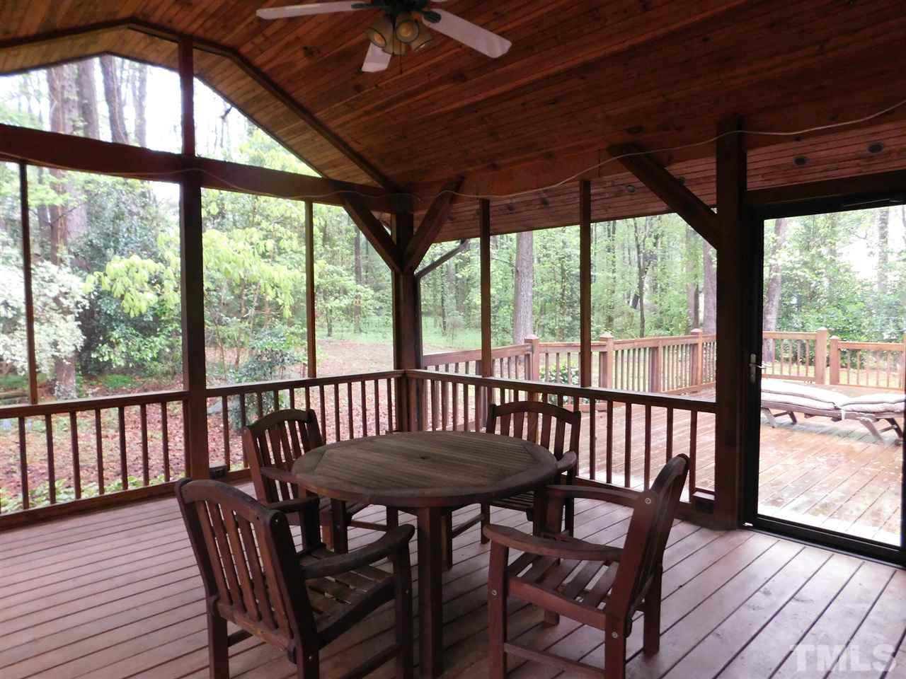 3224 Brennan Drive Raleigh, NC 27613 - Photo 18 of 22 a view of a porch with furniture and wooden floor