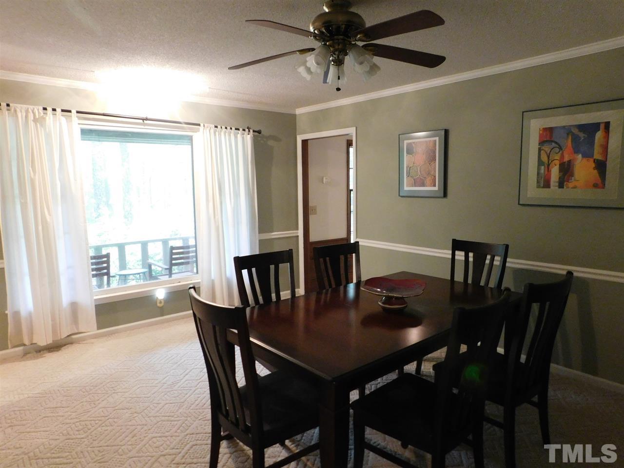 3224 Brennan Drive Raleigh, NC 27613 - Photo 5 of 22 a view of a dining room with furniture window and outside view
