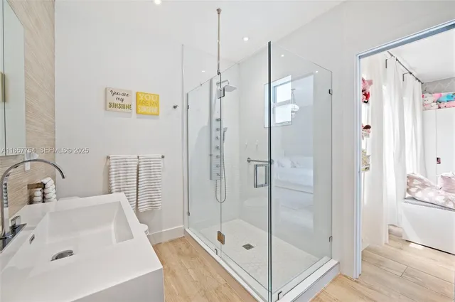 a bathroom with a sink and a shower