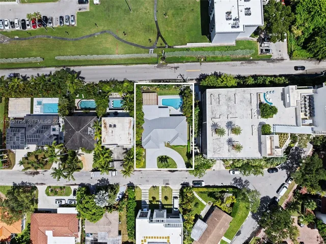 an aerial view of houses with outdoor space