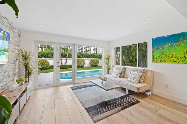 a living room with furniture and a bed