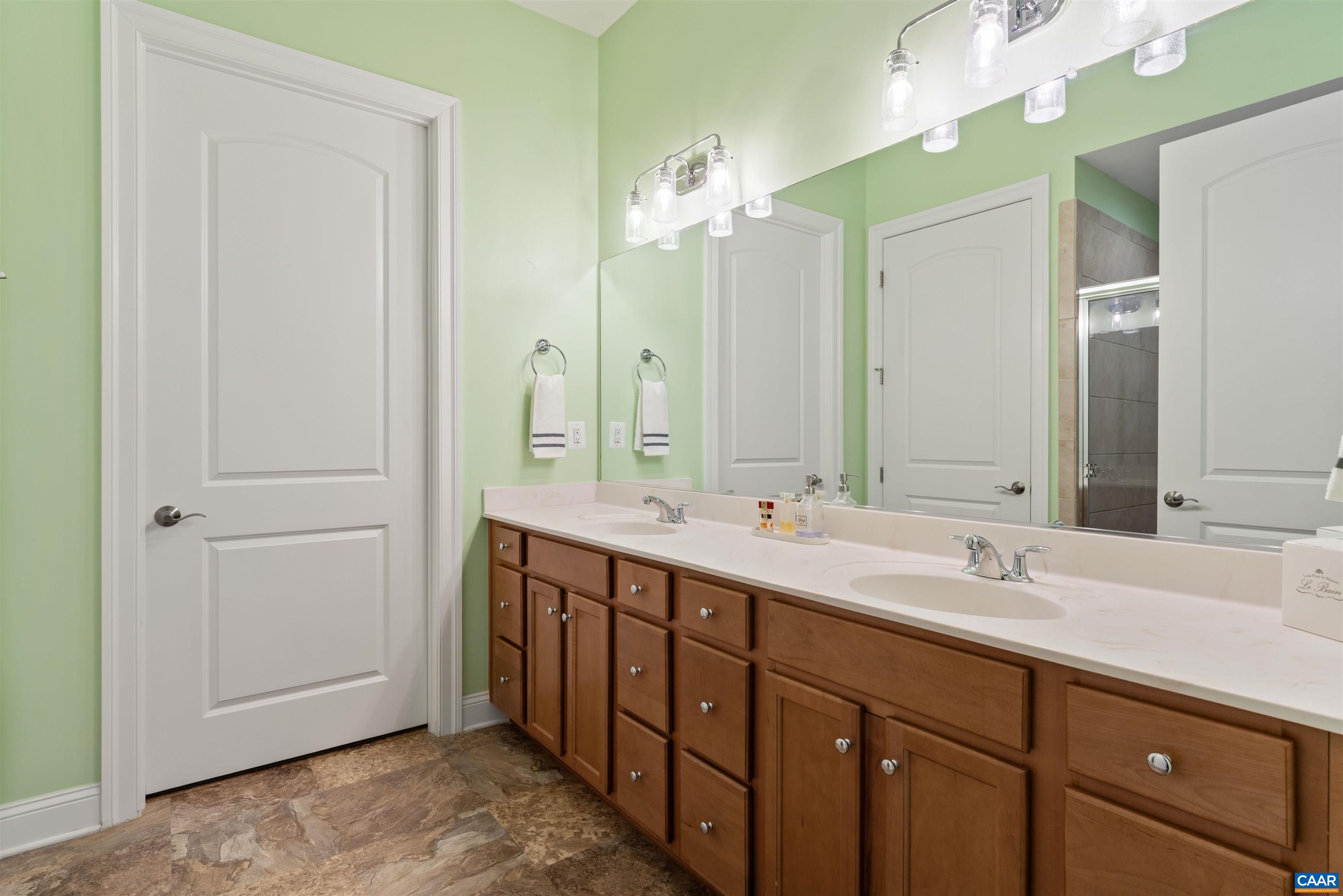 322 Claibourne Road Crozet, VA 22932 - Photo 10 of 25 a bathroom with a double vanity sink and a mirror