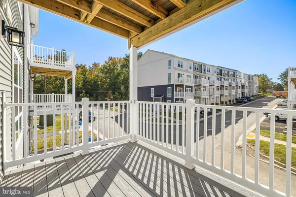 a view of a balcony with wooden floor