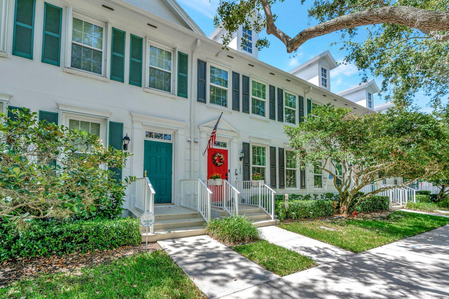180 Freeport Drive Jupiter, FL 33458 - Photo 1 of 34 a front view of a house with garden