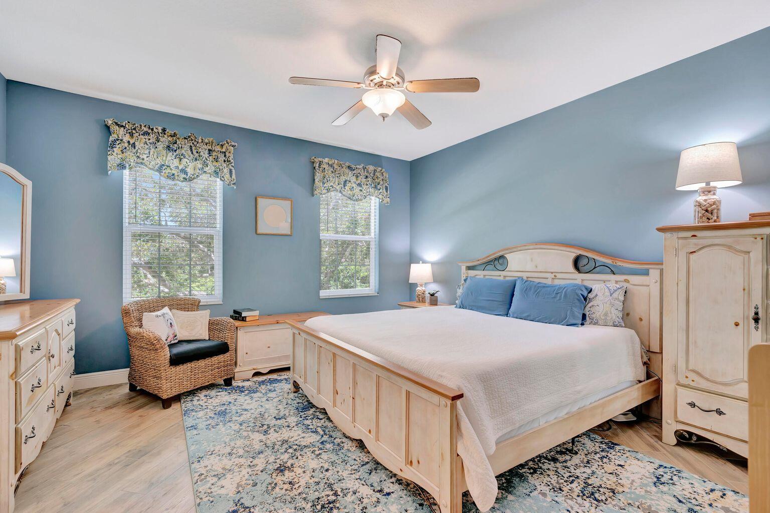 180 Freeport Drive Jupiter, FL 33458 - Photo 25 of 34 a bedroom with a bed and a window