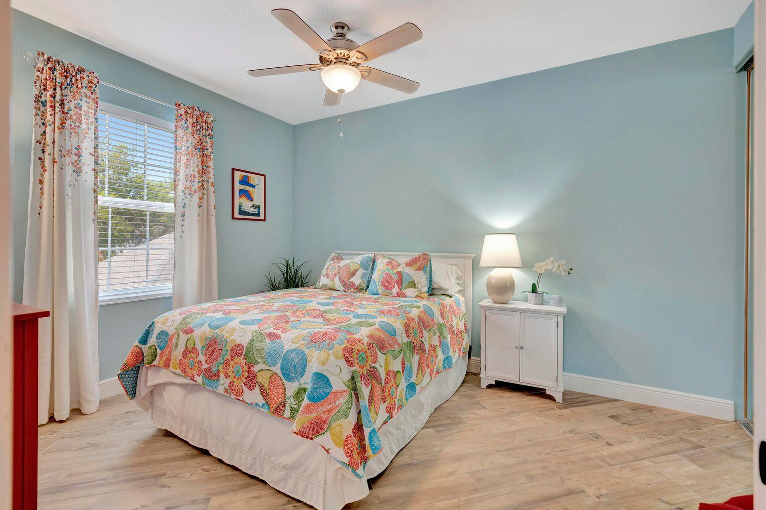 180 Freeport Drive Jupiter, FL 33458 - Photo 28 of 34 a bedroom with a bed and a window