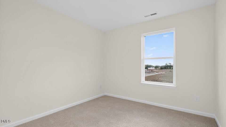 11 Red Clover Drive Angier, NC 27501 - Photo 15 of 33 an empty room with windows