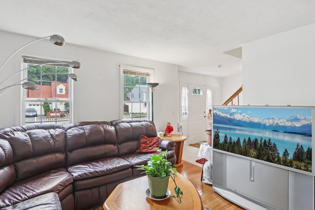 469 North Street Randolph, MA 02368 - Photo 11 of 42 a living room with furniture flowerpot and wooden floor