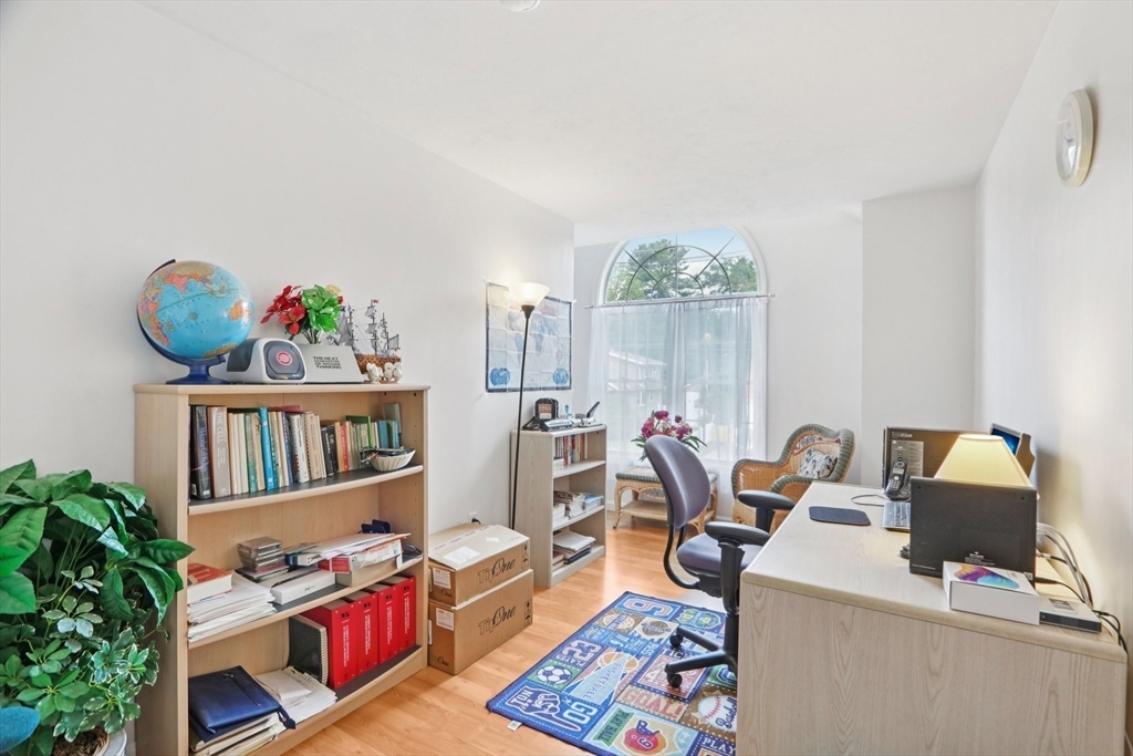 469 North Street Randolph, MA 02368 - Photo 25 of 42 a living room with furniture and a book shelf