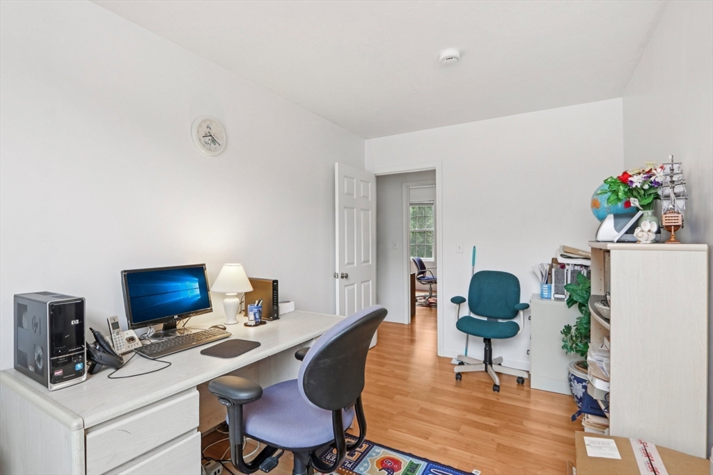 469 North Street Randolph, MA 02368 - Photo 26 of 42 a workspace with furniture and wooden floor