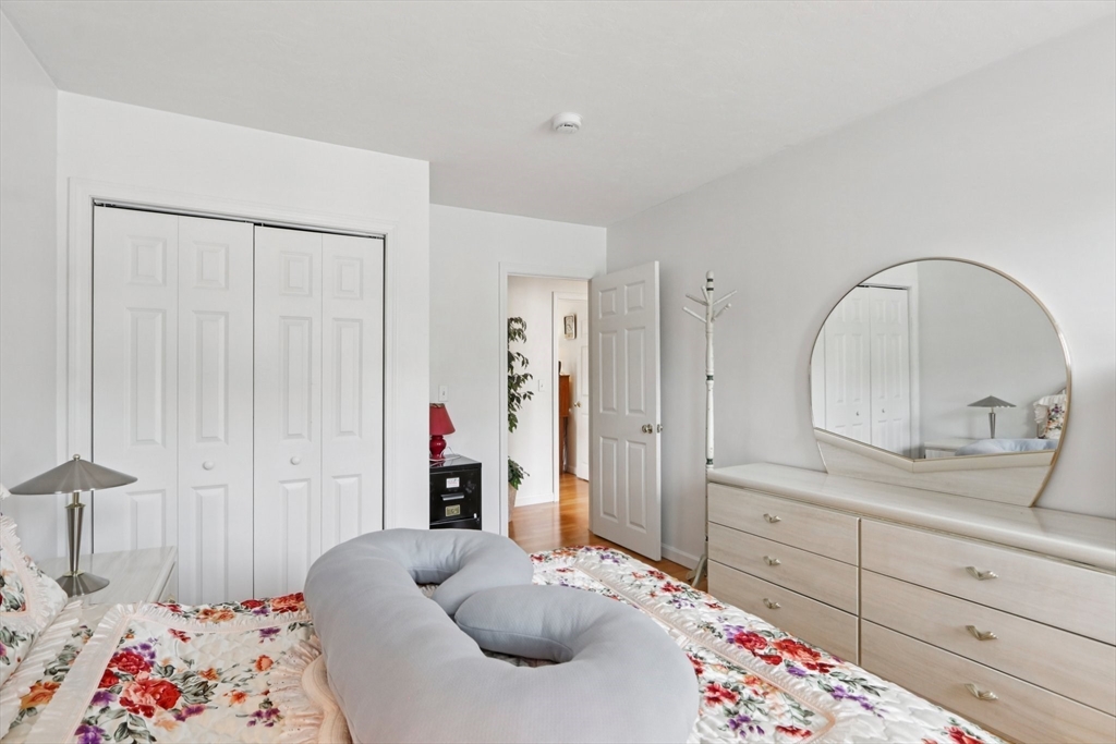 469 North Street Randolph, MA 02368 - Photo 31 of 42 a bedroom with a bed and a dresser