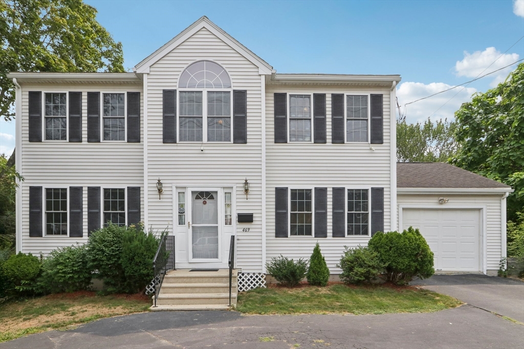 469 North Street Randolph, MA 02368 - Photo 42 of 42 a view of a brick house with large windows and plants