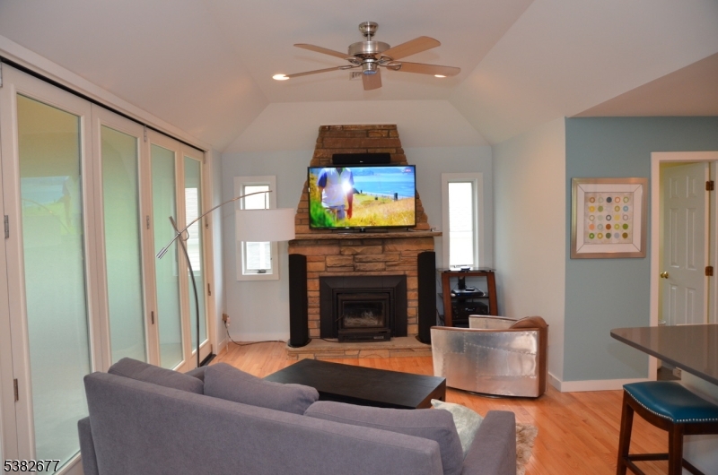 3 Old Lane Newfoundland, NJ 07435 - Photo 5 of 15 a living room with furniture a fireplace and a flat screen tv