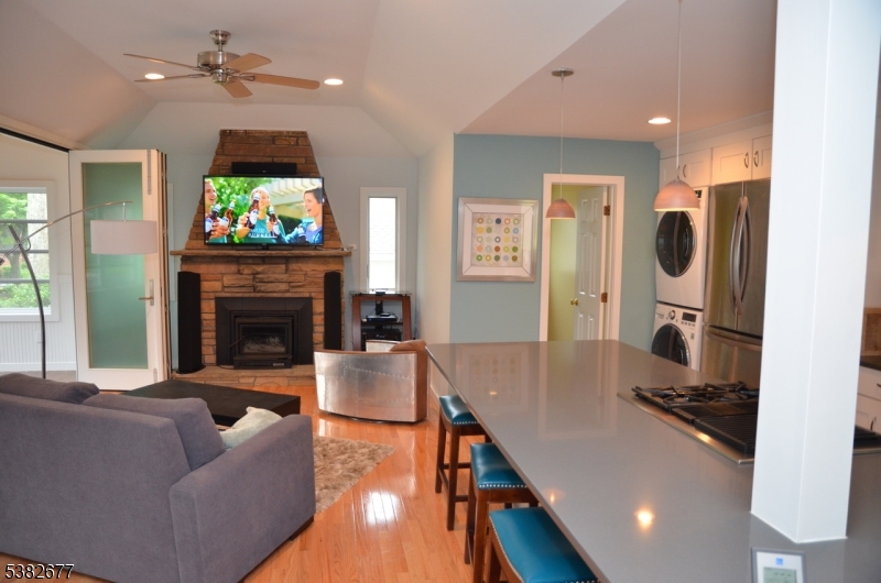 3 Old Lane Newfoundland, NJ 07435 - Photo 6 of 15 a living room with furniture a fireplace and a flat screen tv