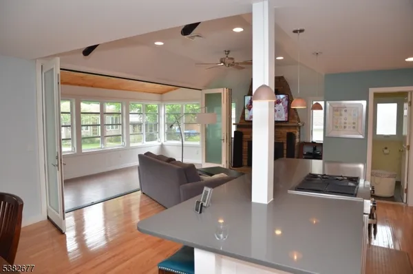 a living room with furniture and large windows