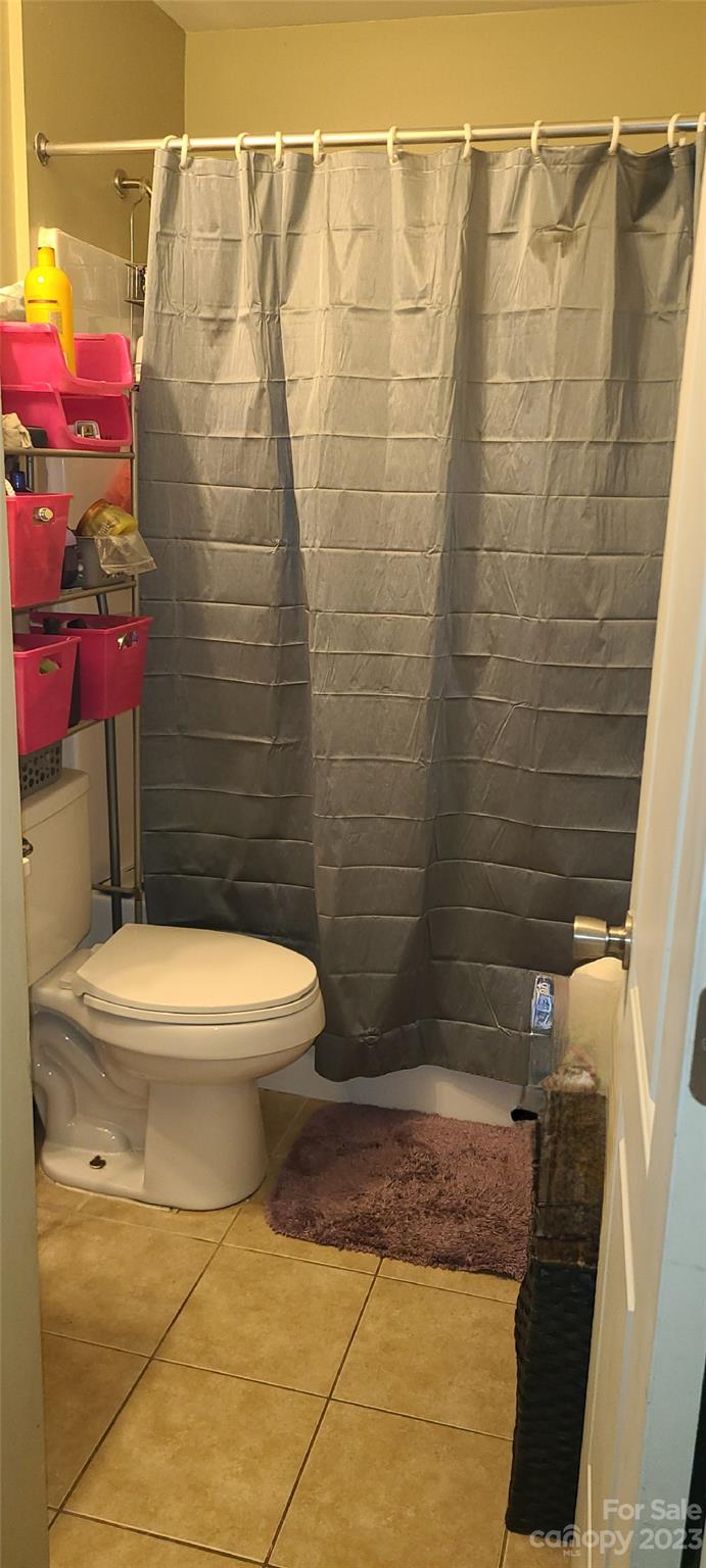 519 Covington Street, Unit 5/A& B Rockingham, NC 28379 - Photo 7 of 18 a bathroom with a toilet and shower
