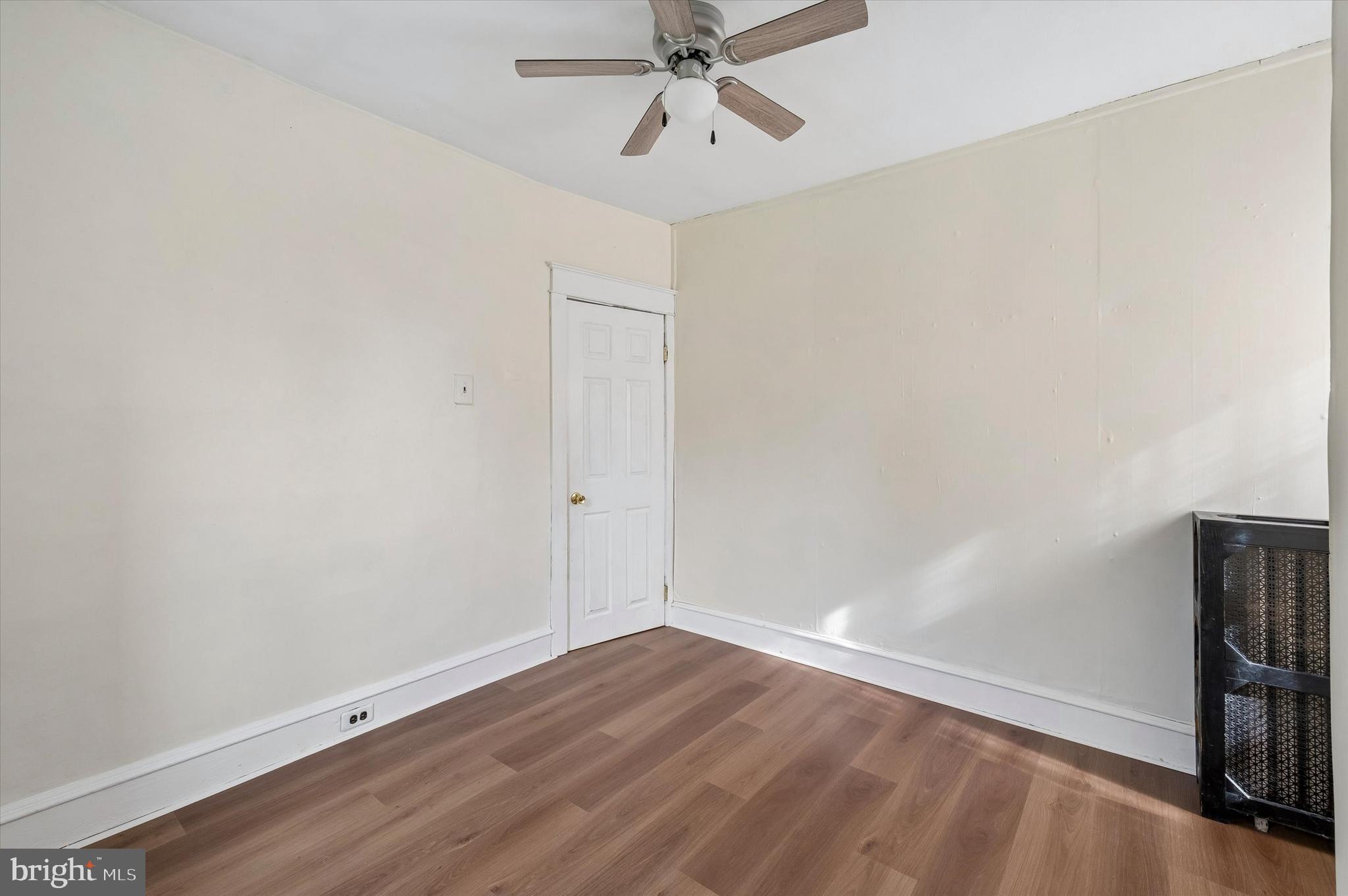 1008 East 18th Street Chester, PA 19013 - Photo 17 of 25 wooden floor in an empty room