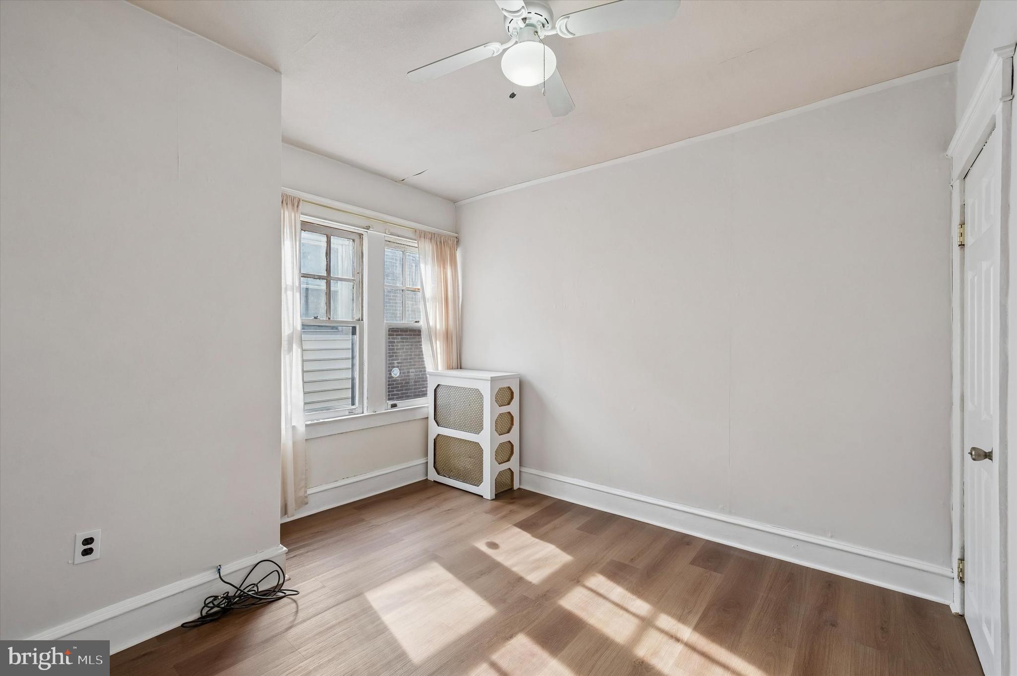 1008 East 18th Street Chester, PA 19013 - Photo 18 of 25 an empty room with windows