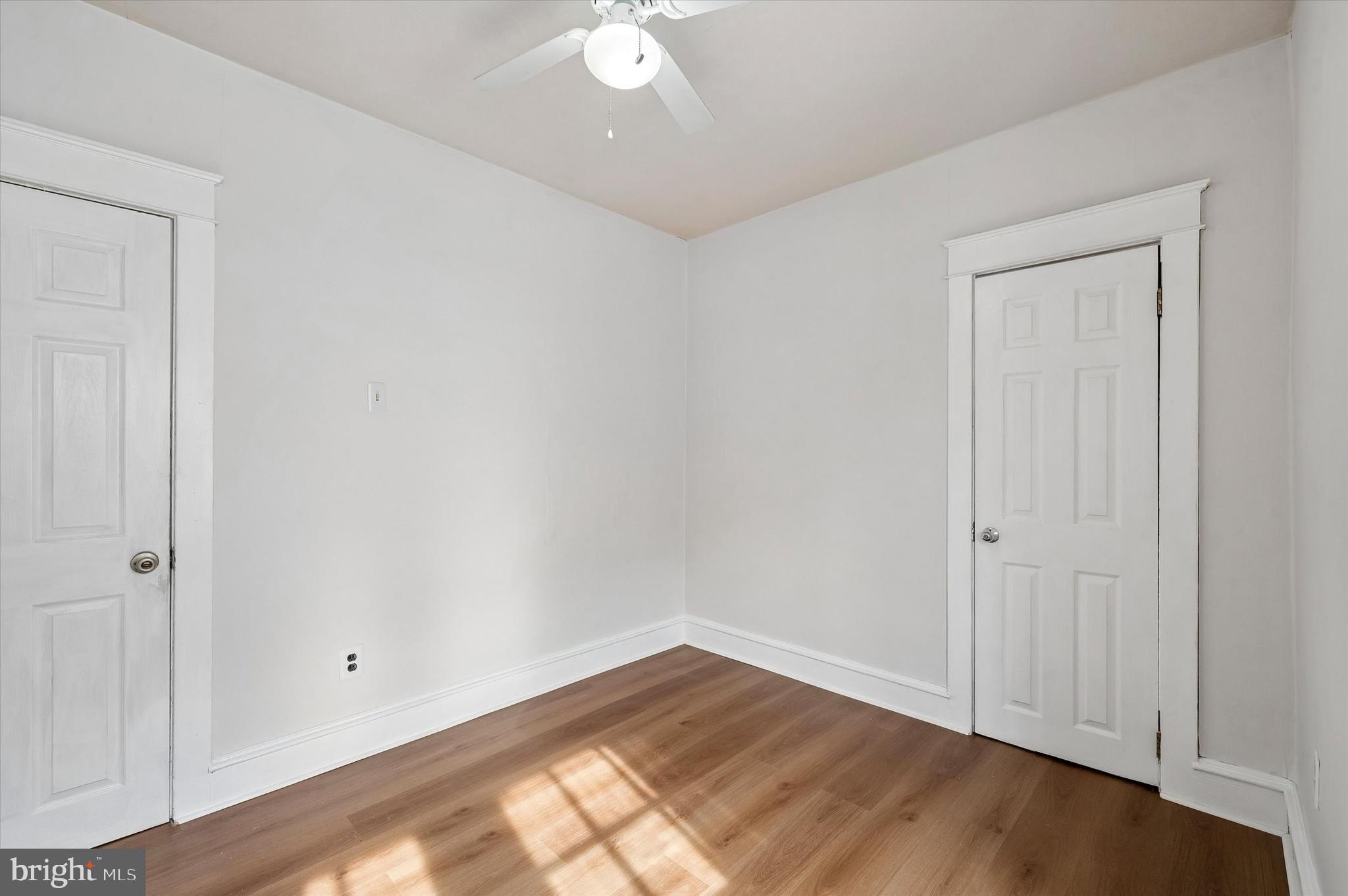 1008 East 18th Street Chester, PA 19013 - Photo 19 of 25 wooden floor in an empty room