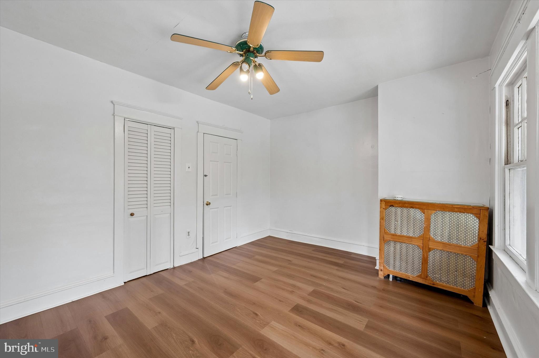 1008 East 18th Street Chester, PA 19013 - Photo 21 of 25 wooden floor in an empty room with a window
