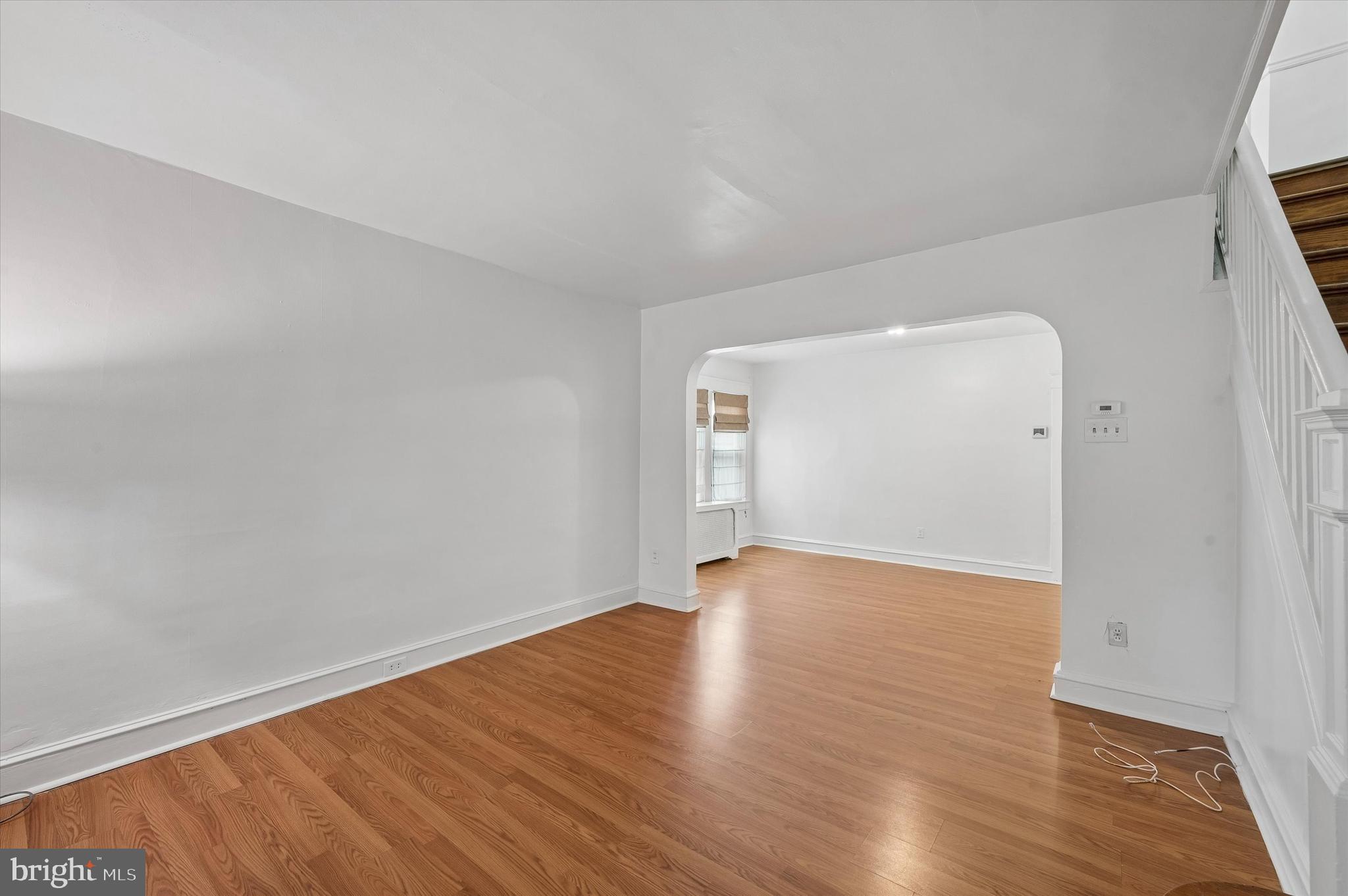 1008 East 18th Street Chester, PA 19013 - Photo 4 of 25 a view of an empty room with wooden floor